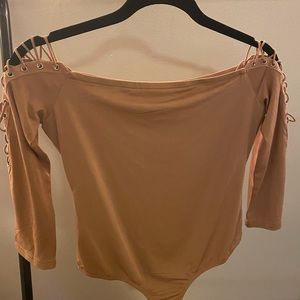 Tan bodysuit.